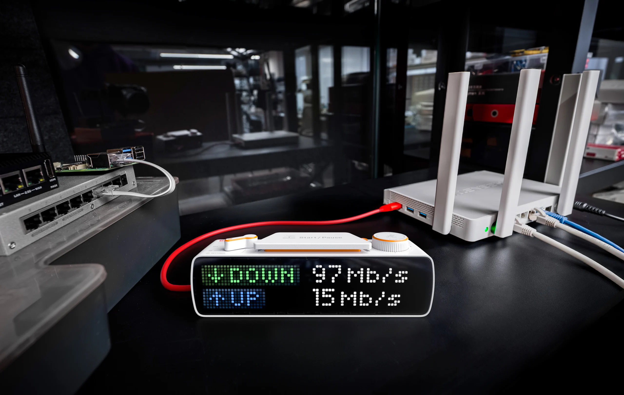 BUSY Bar showing internet speed test results — 97 Mb/s down, 15 Mb/s up — beside a router
